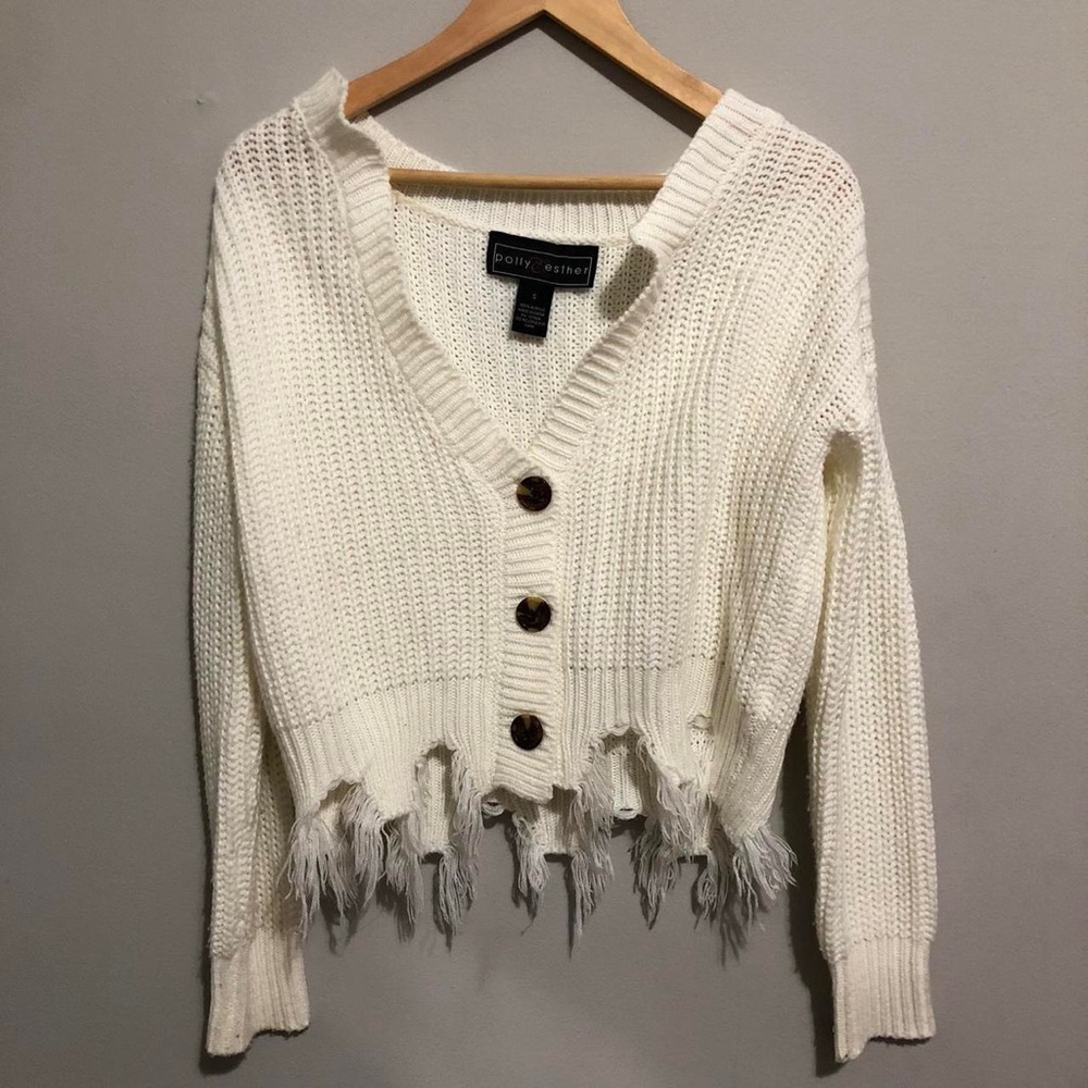 White knitted cardigan button sweater ripped modern detailing at the bottom 🤍